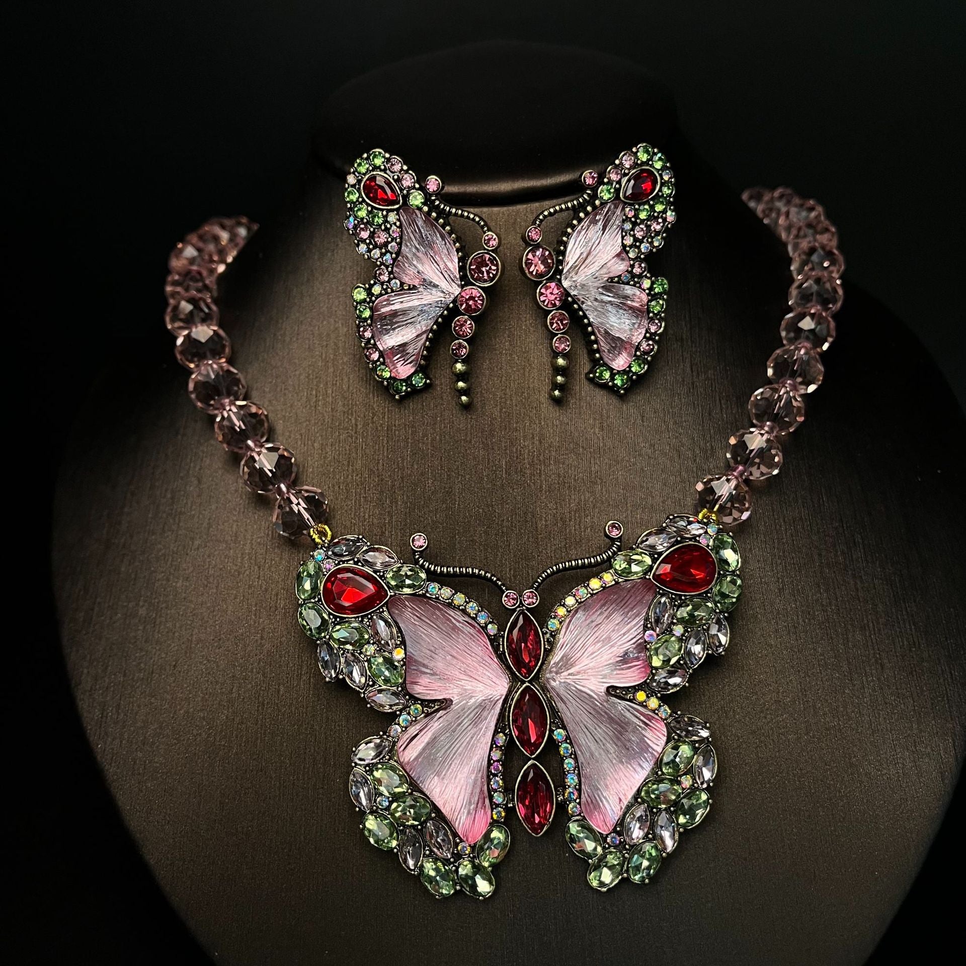 Butterfly-themed necklace and earrings with gemstones