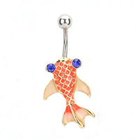 Gold koi fish-shaped belly button ring with blue gemstones on a white background