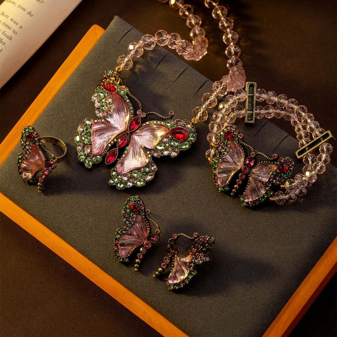 Vintage Rococo Butterfly-themed jewelry set including ring, earrings, and bracelet 