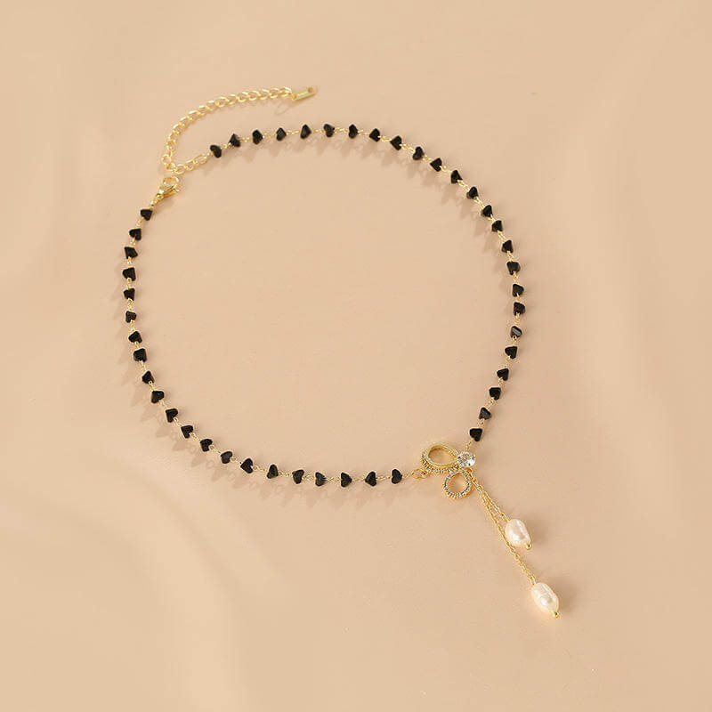 Black Crystal Bow Pearl Y Necklace