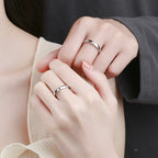 A couples wearing silver moon sun rings