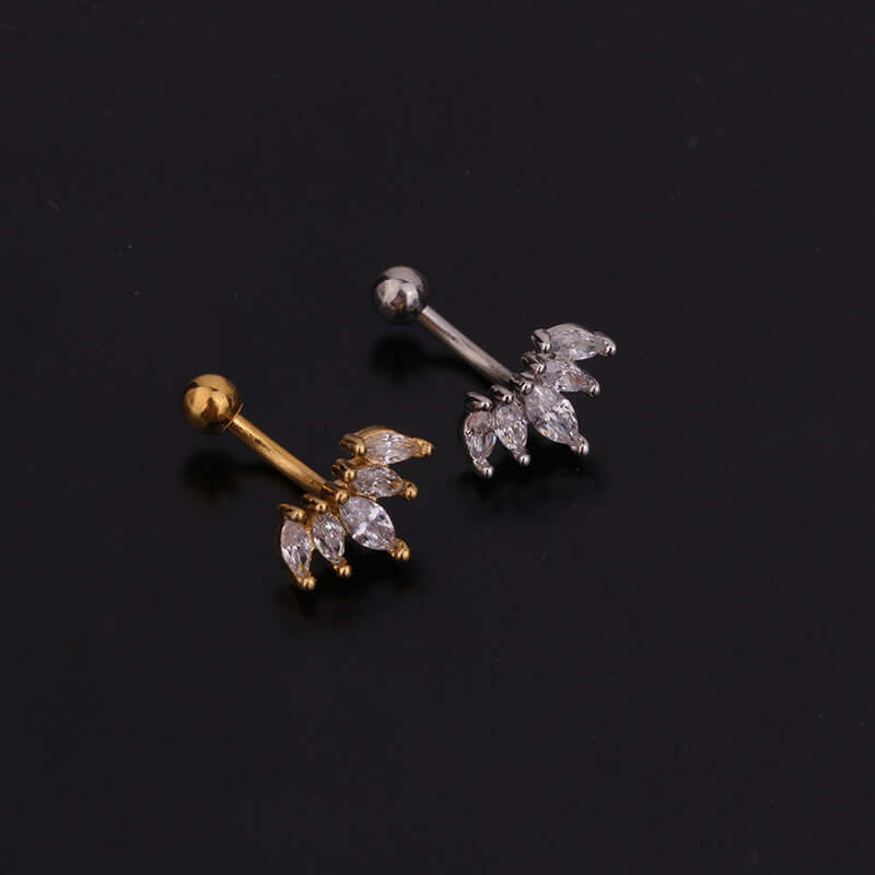 16G cartilage daith ear jacket earrings in silver and gold with leaf design and CZ stones on black background.