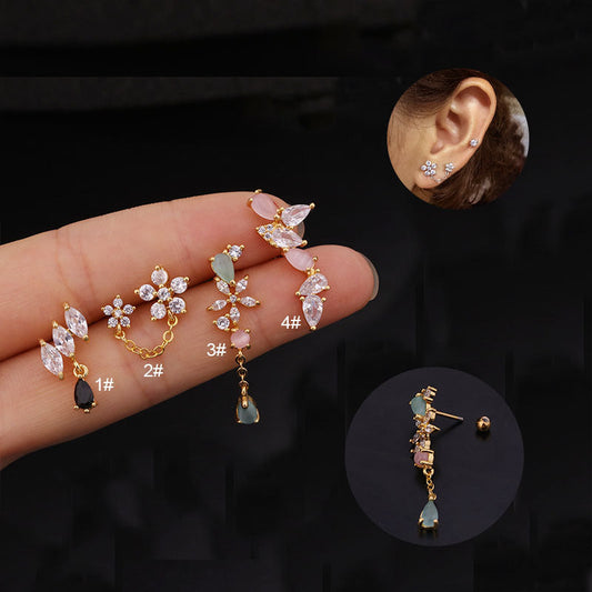 Various 20G cartilage dangle stud earrings in silver, gold, and rose gold with different patterns displayed on finger and ear models.