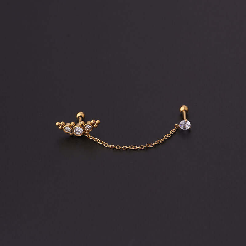 Gold-plated 16G cartilage link chain dangle earrings with cubic zirconia on black background