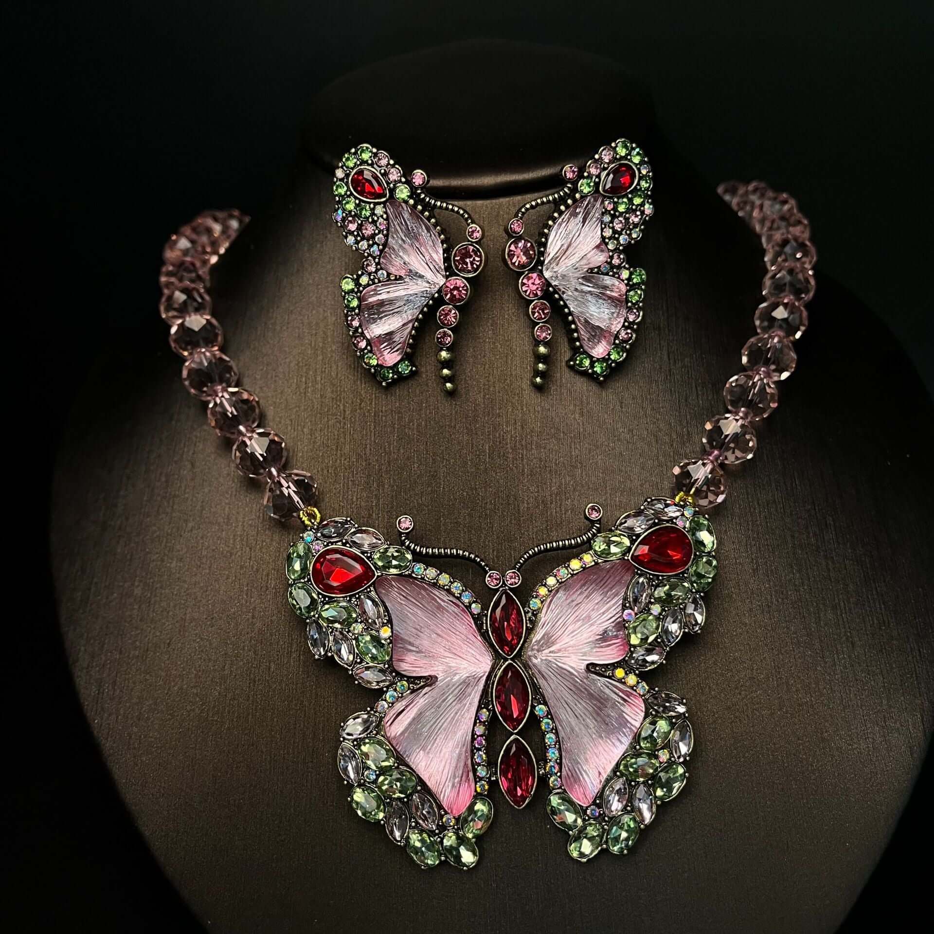 Butterfly-themed necklace and earrings with gemstones 