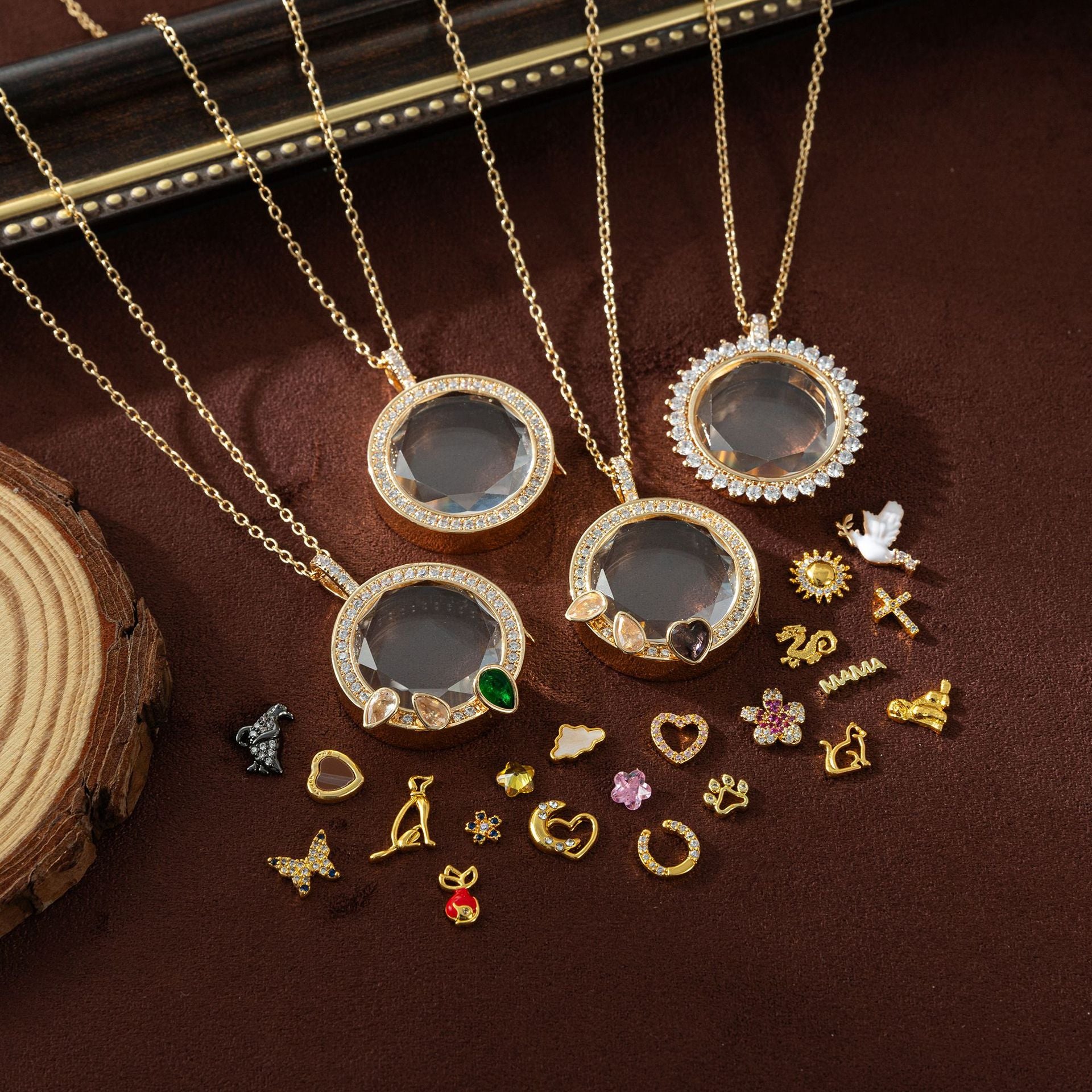 Three gold necklaces with circular pendants on a brown surface with additional pendants.