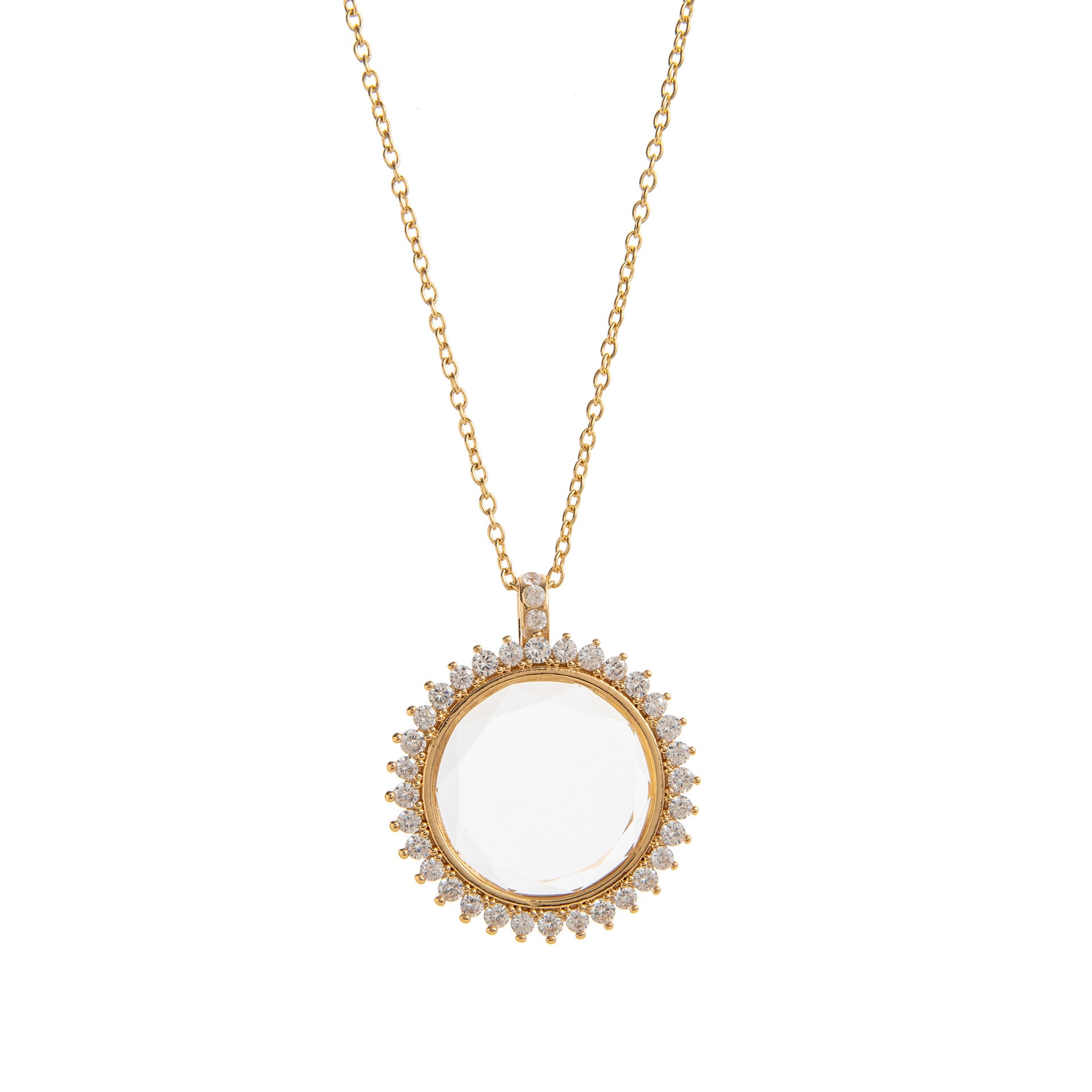 Gold necklace with a round pendant on a white background