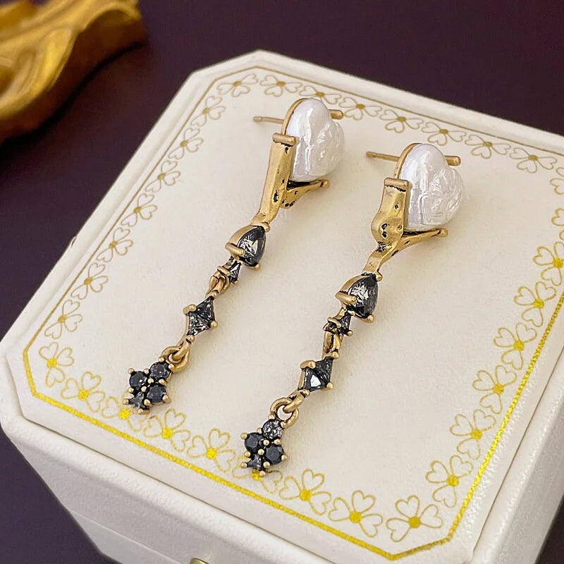 Radiant Black Heart Pearl Drop Earrings